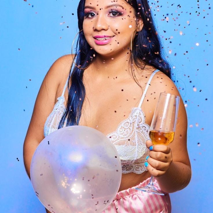 Aarya Patel, Lead Design Curator at Compound Studio Haven, reviewing corporate floral arrangements